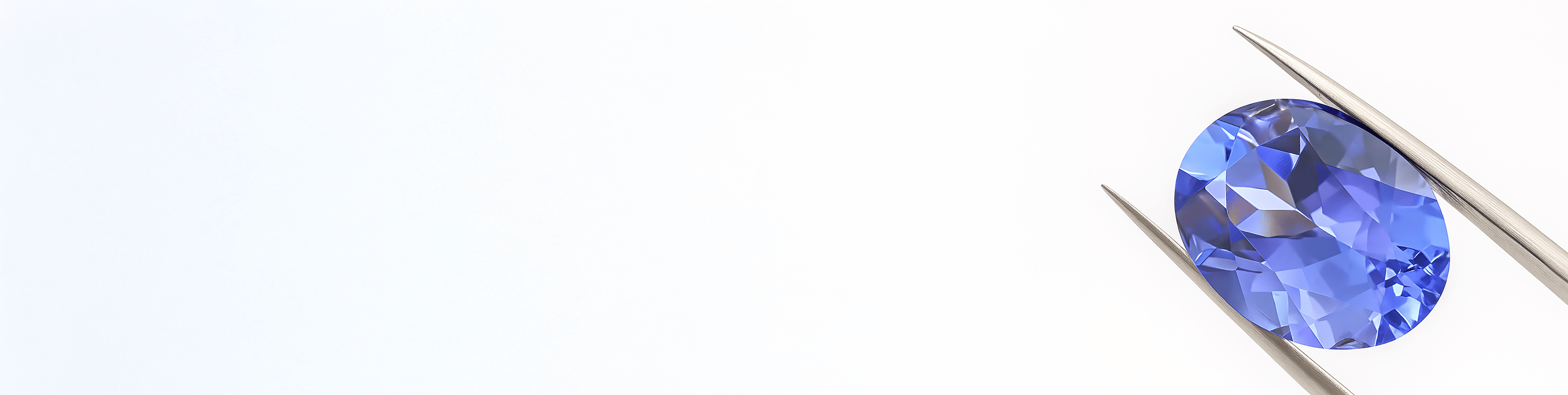 Oszlifowany tanzanit w szczypcach jubilerskich Oszlifowany tanzanit w szczypcach jubilerskich