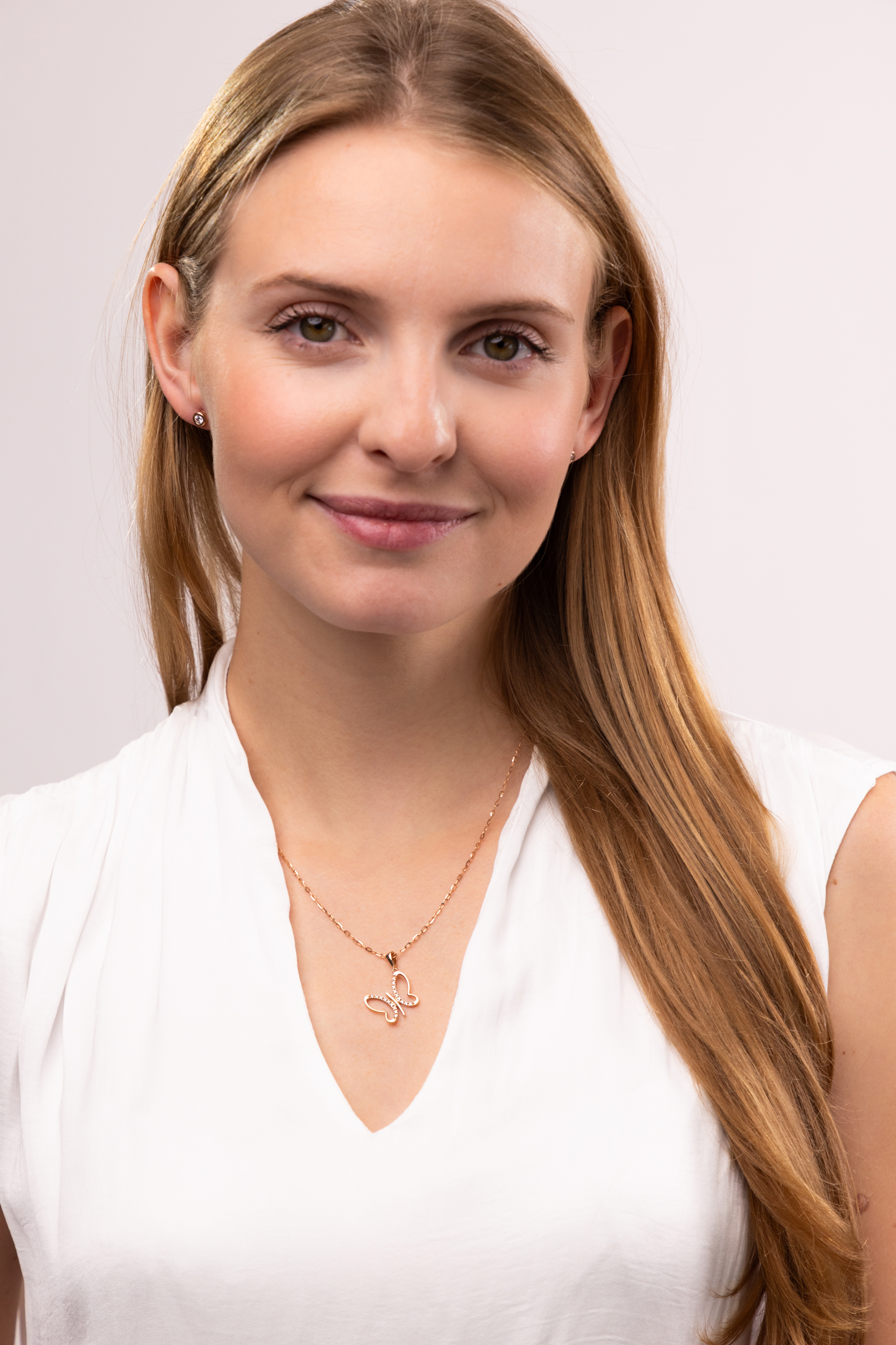 Zawieszka z różowego złota w kształcie ażurowego motyla z cyrkoniami, próba 585