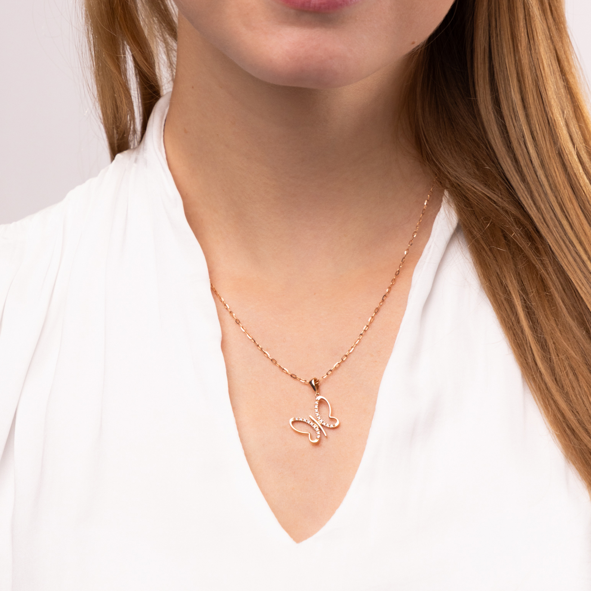 Zawieszka z różowego złota w kształcie ażurowego motyla z cyrkoniami, próba 585