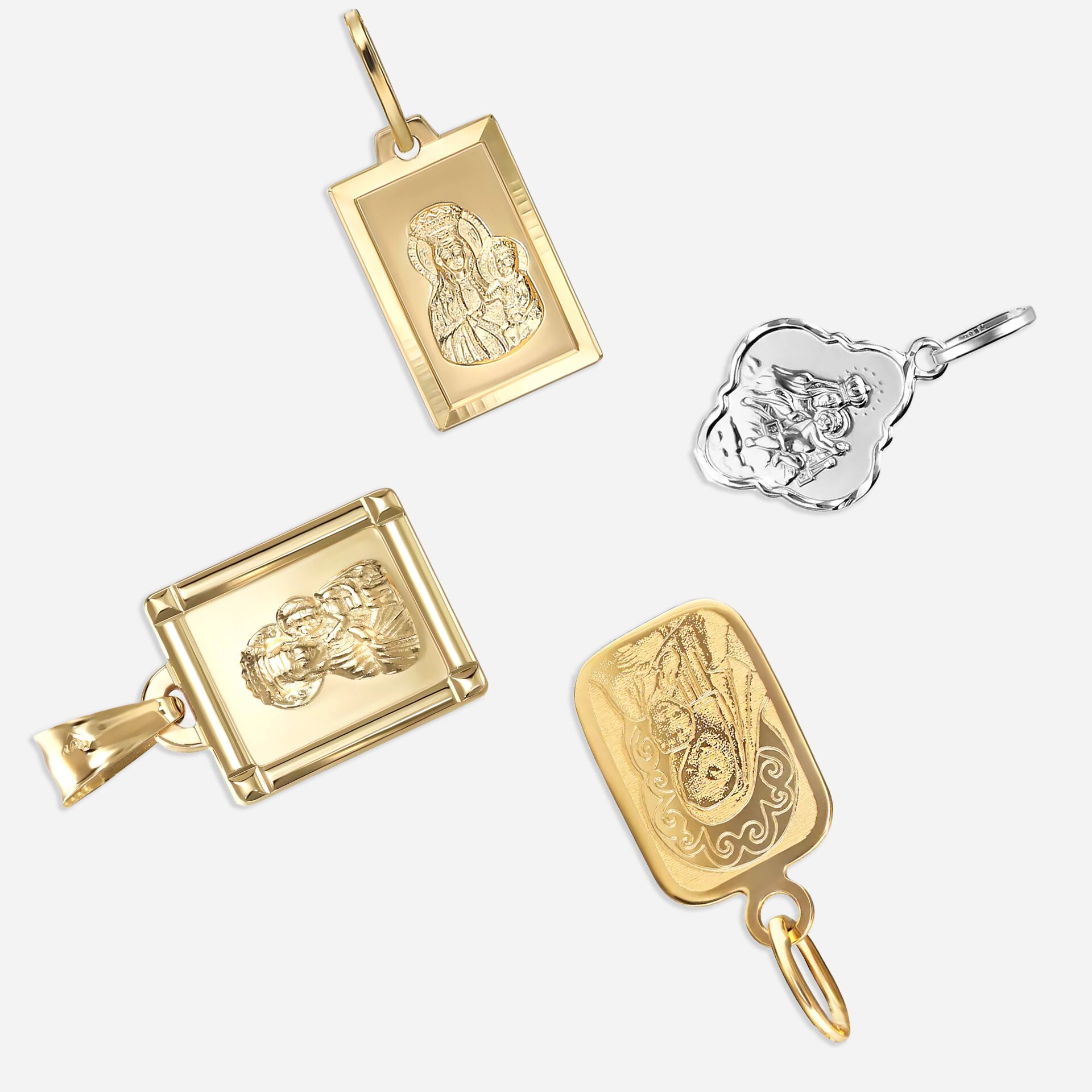 Kompozycja złotych medalików 585 na szarym tle